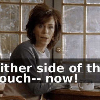 Either side of the couch-- now!