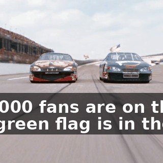 The 200,000 fans are on their feet, and the green flag is in the air.