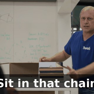 Sit in that chair.