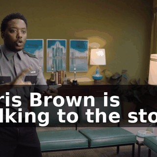 Chris Brown is walking to the store.