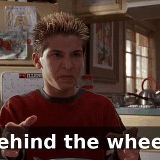 behind the wheel.