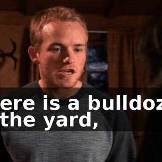 There is a bulldozer in the yard,