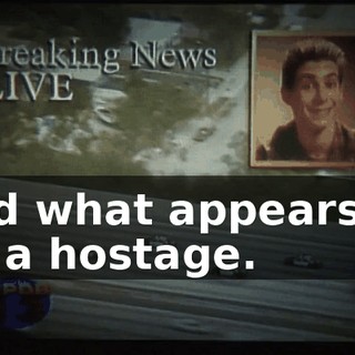 and what appears to be a hostage.