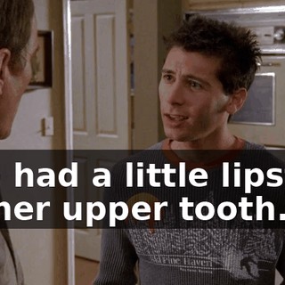 She had a little lipstick on her upper tooth.