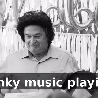 [funky music playing]