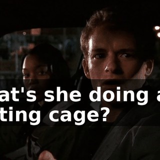 What's she doing at a batting cage?
