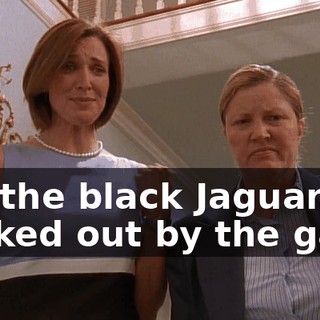 It's the black Jaguar parked out by the gate.