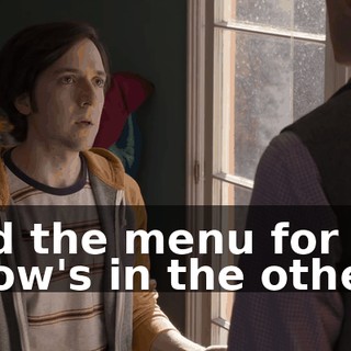 and the menu for Mr. Chow's in the other.