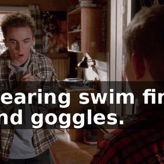 wearing swim fins and goggles.
