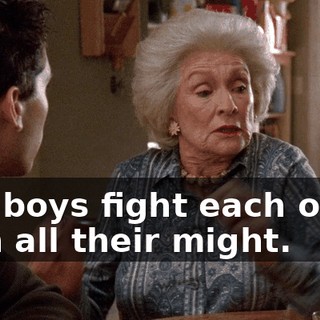 The boys fight each other with all their might.