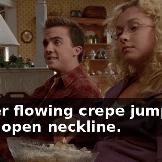 in her flowing crepe jumpsuit with open neckline.
