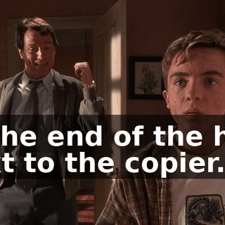 at the end of the hall, next to the copier.