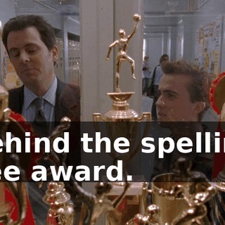 Behind the spelling bee award.