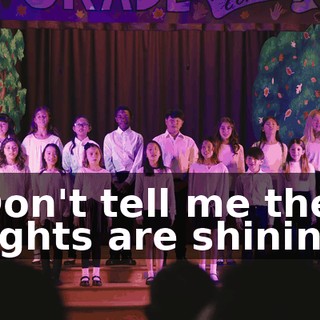 ♪ Don't tell me the lights are shining ♪