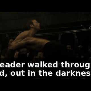 The leader walked through the crowd, out in the darkness.