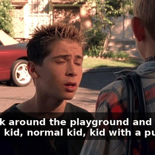 We look around the playground and we see normal kid, normal kid, kid with a purse.