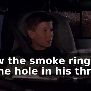 blew the smoke ring out of the hole in his throat.