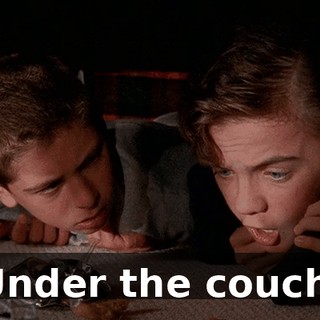 Under the couch.