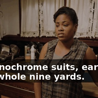 - Monochrome suits, earring, the whole nine yards.