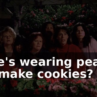 She's wearing pearls to make cookies?