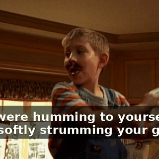♪ You were humming to yourself And softly strumming your guitar ♪