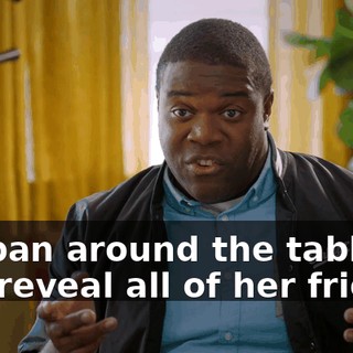 We pan around the table, and reveal all of her friends