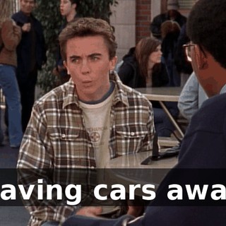 waving cars away.