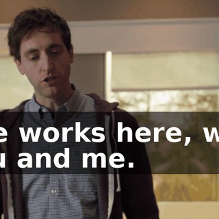 She works here, with you and me.
