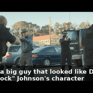Sorry, a big guy that looked like Dwayne "The Rock" Johnson's character