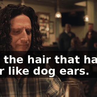 and the hair that hangs over like dog ears.