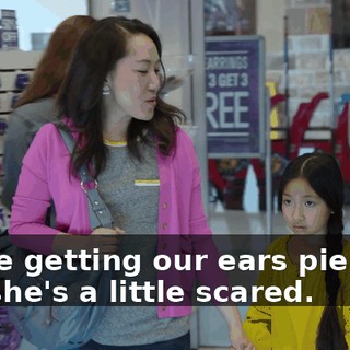 We're getting our ears pierced, but she's a little scared.
