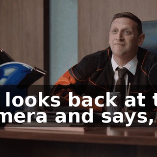 He looks back at the camera and says,