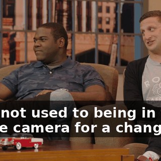 He's not used to being in front of the camera for a change.