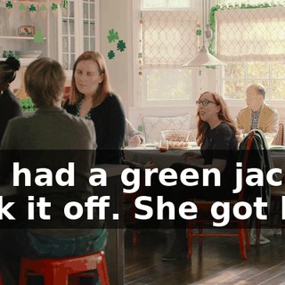 She had a green jacket. Took it off. She got hot.