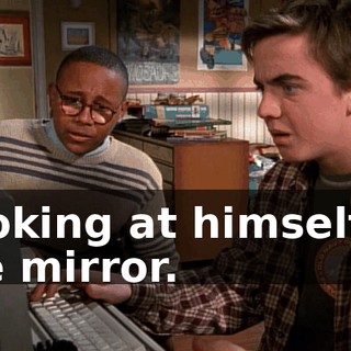 Looking at himself in the mirror.