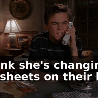 I think she's changing the sheets on their bed.