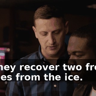 as they recover two frozen bodies from the ice.