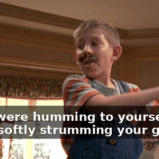 ♪ You were humming to yourself And softly strumming your guitar ♪